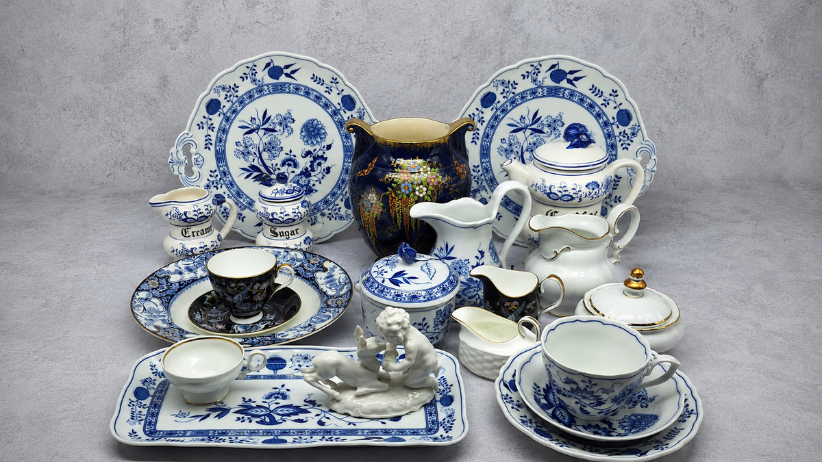 A curated collection of blue and white antique ceramics including Meissen-style onion pattern plates, tea sets, figurines and decorative pieces, typical of the South African antiques market.