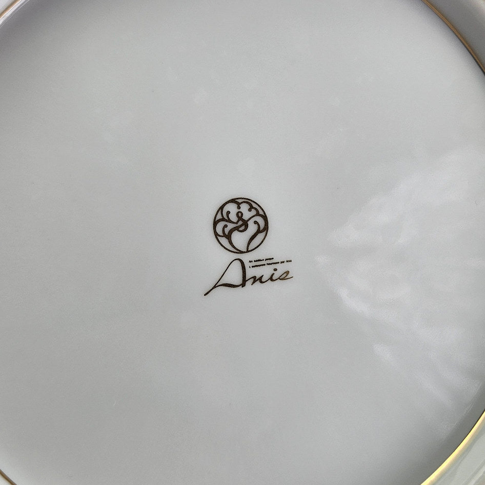 Underside of Anisa floral plate with printed maker mark