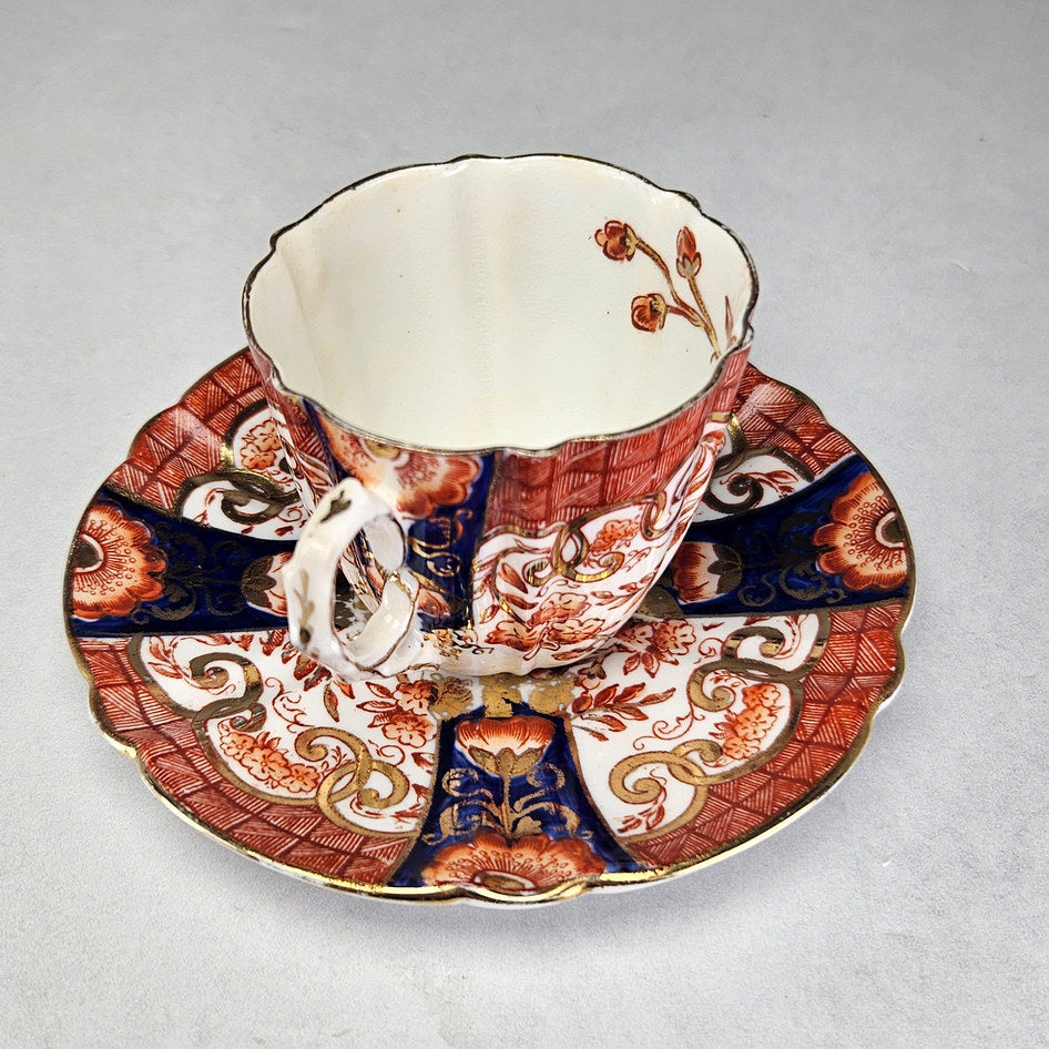 Overhead view of Pearce cup and patterned scalloped saucer
