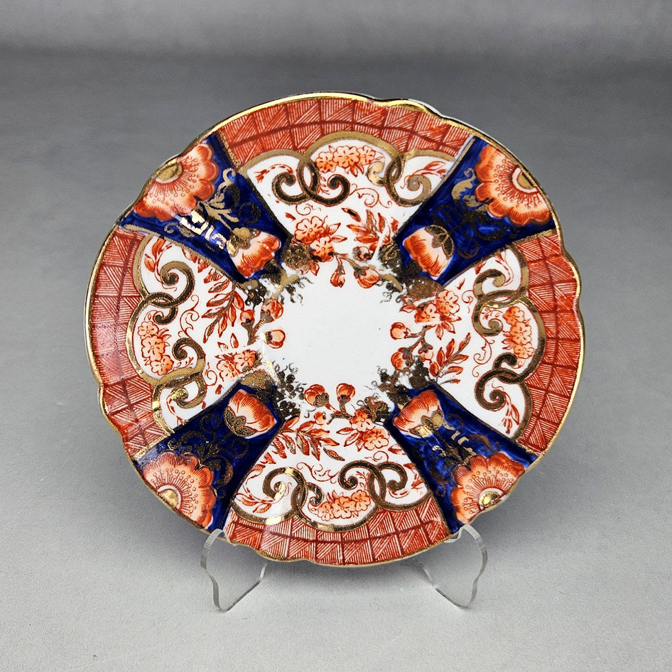 Pearce cup showing patterned exterior and angular handle