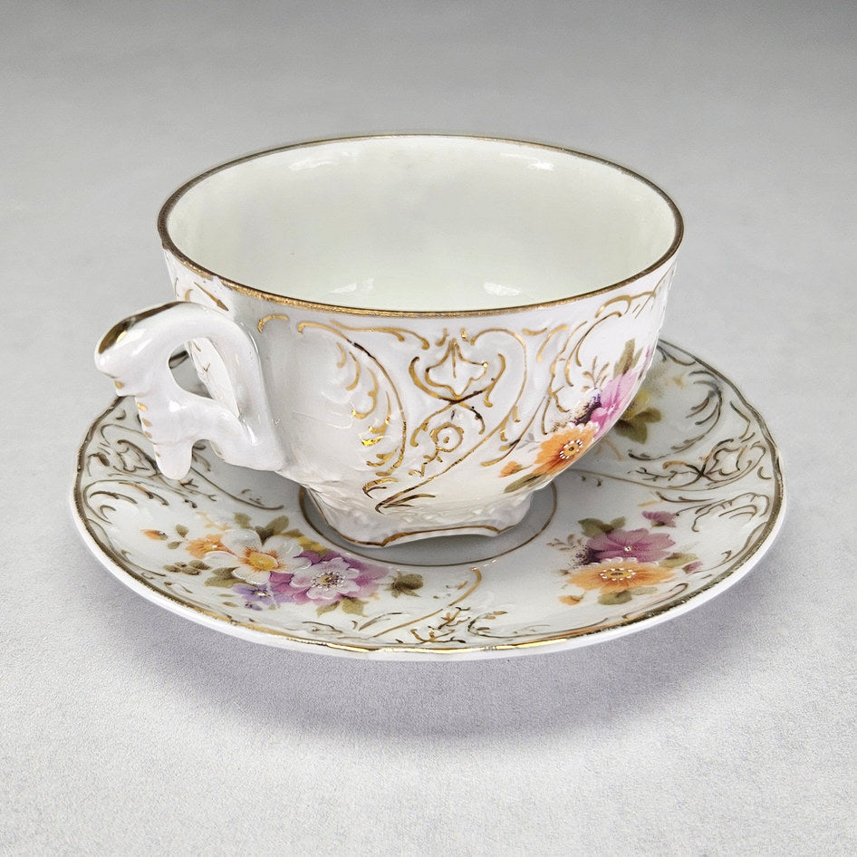 Altwasser porcelain cup and saucer with coloured flowers