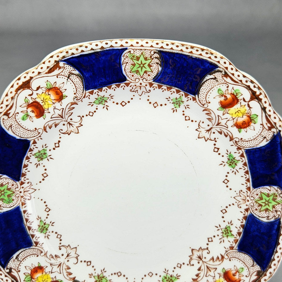 Side view of Doric China shaped floral plate