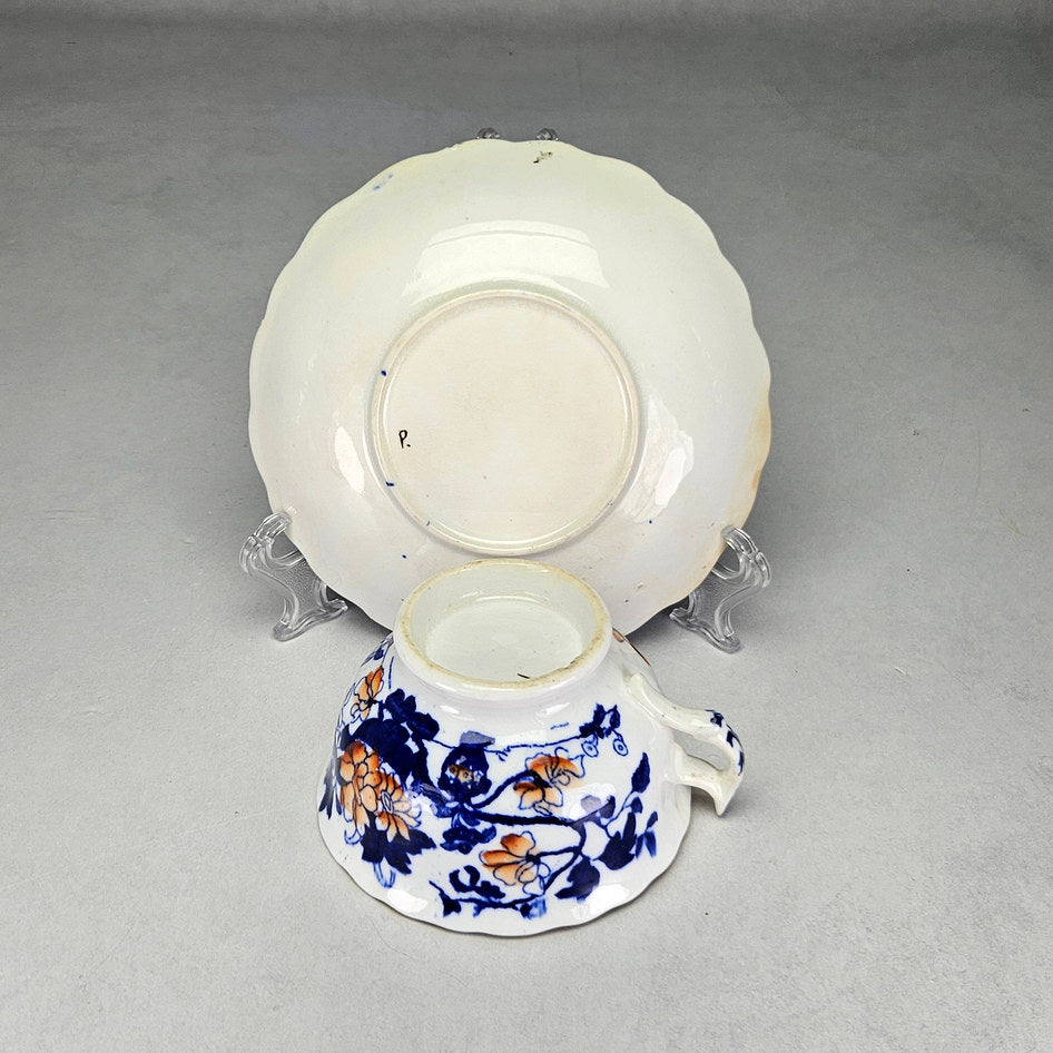 Unmarked undersides with handwritten P on floral saucer