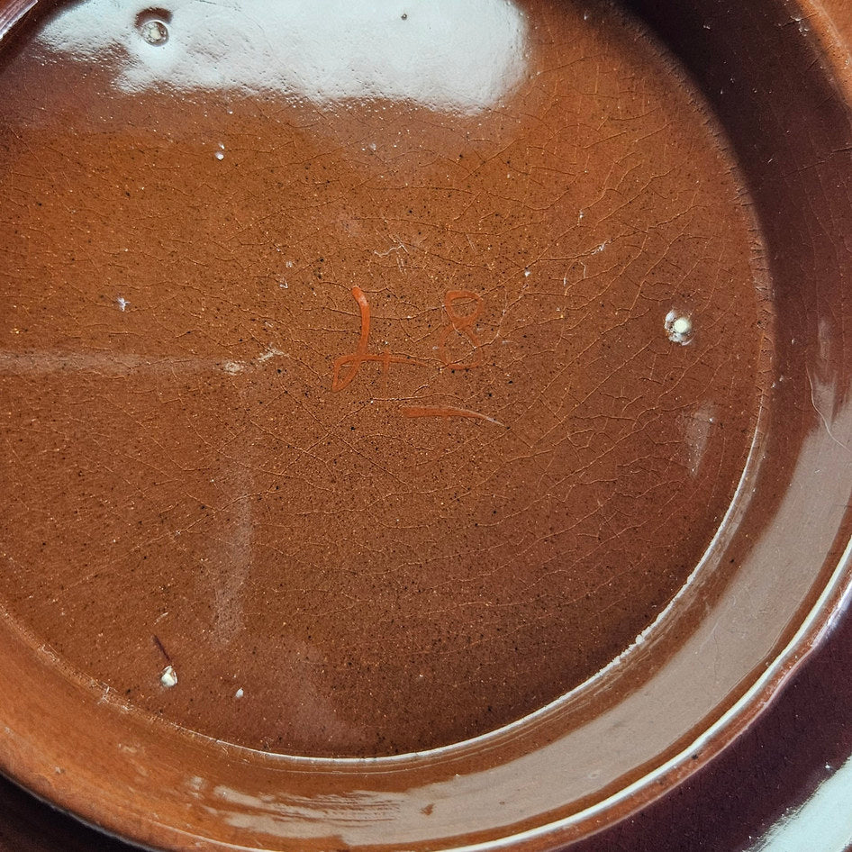 Brown glazed underside of unmarked Imari teapot stand