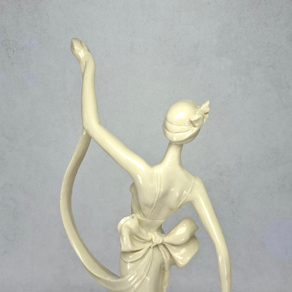 Art Deco-Style Cream Lady Figurine with Flowing Ribbon Detail