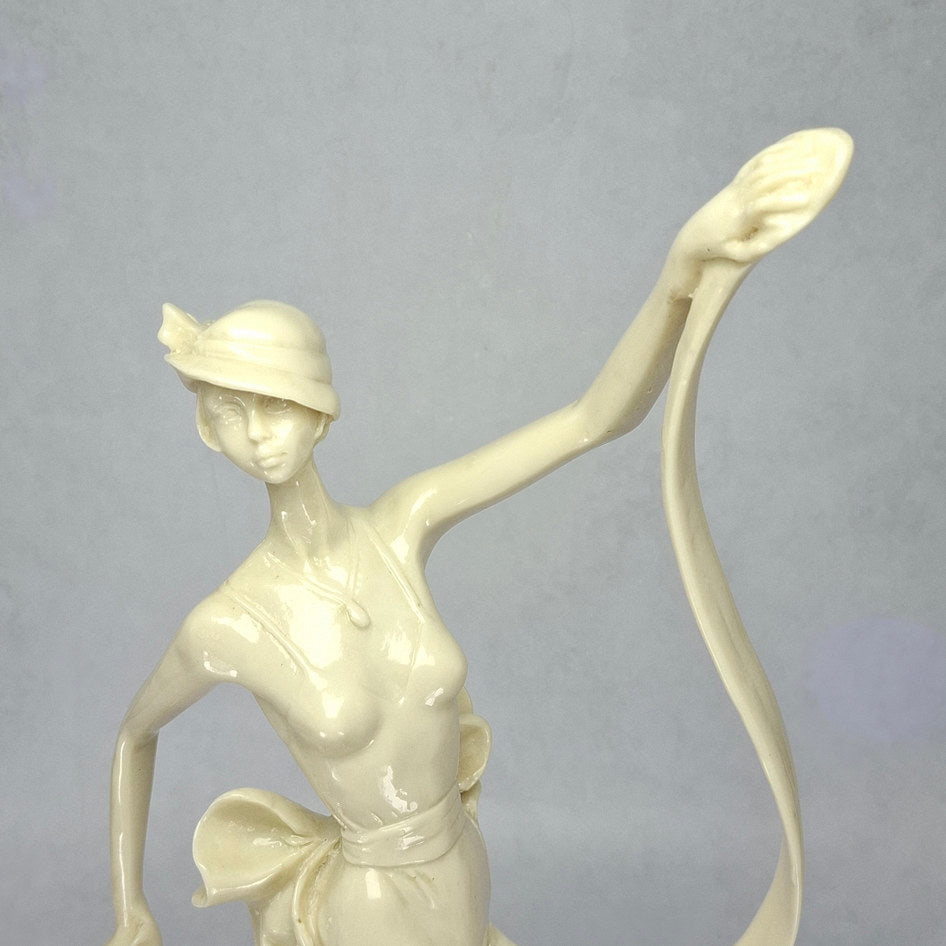 Art Deco-Style Cream Lady Figurine with Flowing Ribbon Detail