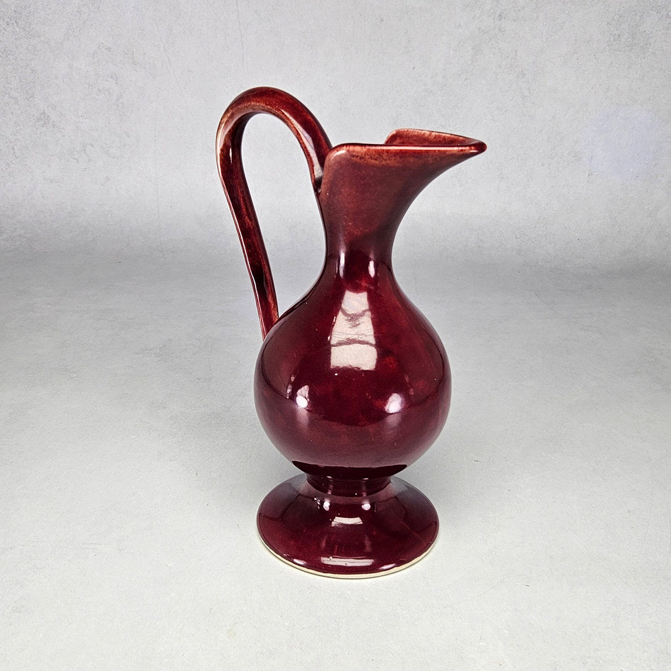 Drostdy Ware burgundy ewer showing rounded body and pedestal