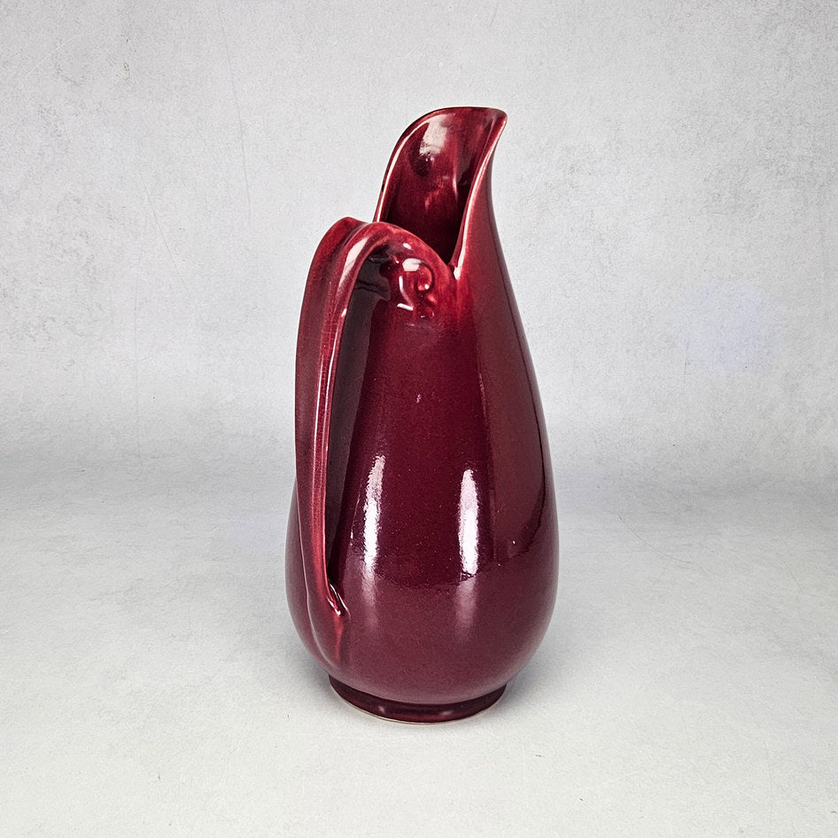 Drostdy Ware burgundy tall ewer showing curved loop handle