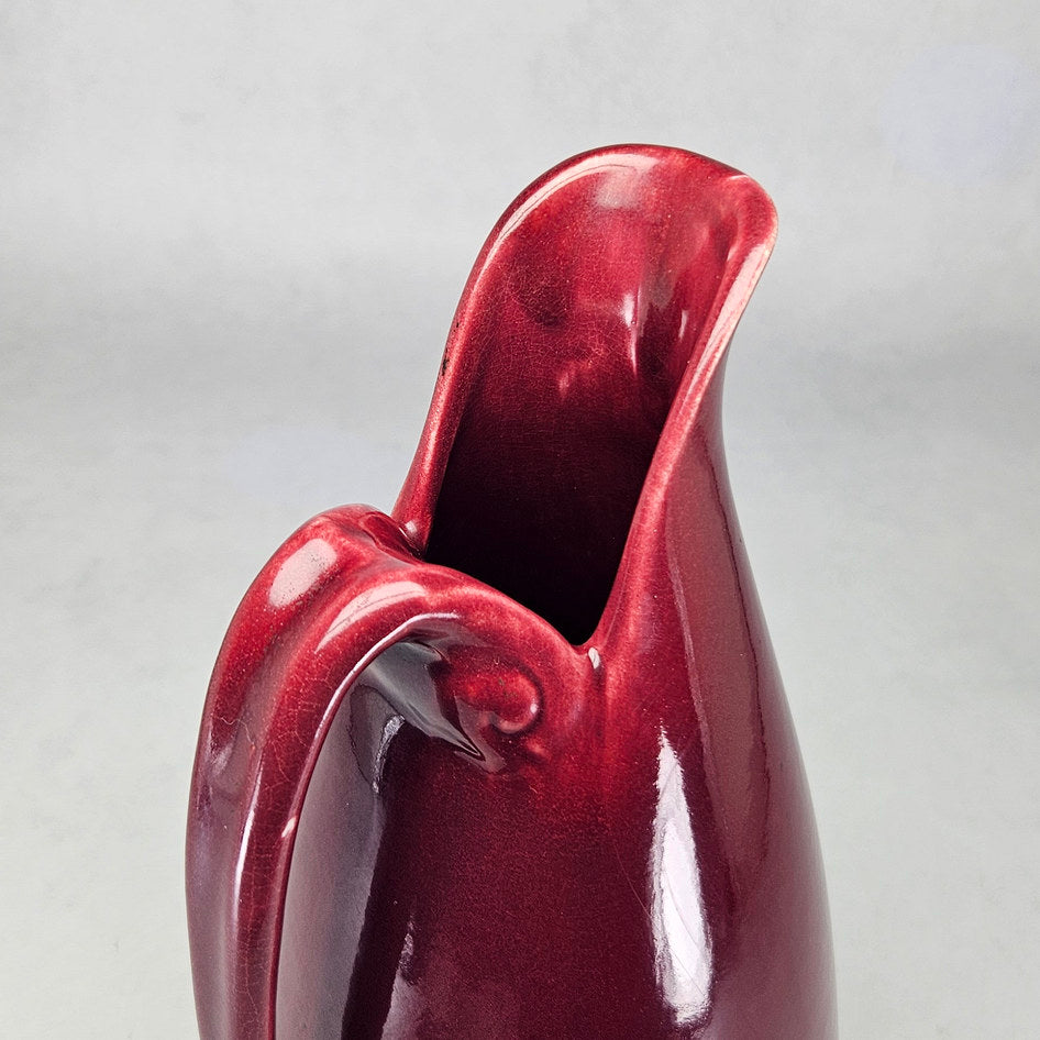 Drostdy Ware burgundy tall ewer viewed towards glazed opening