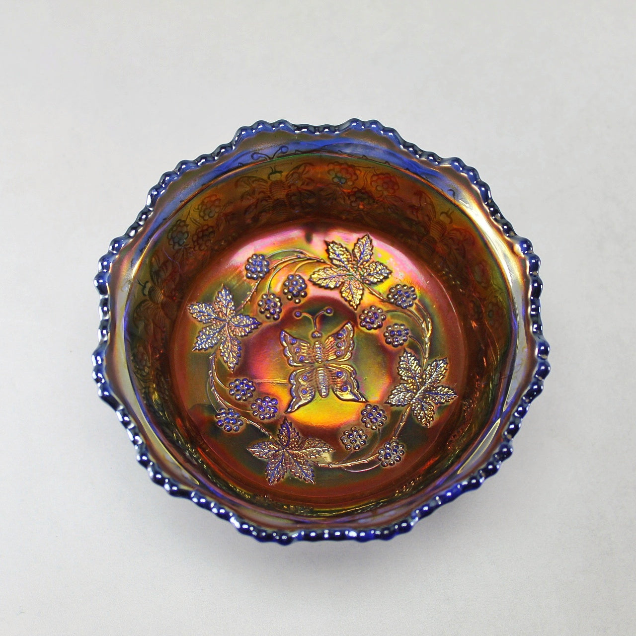 Fenton Carnival Glass Butterfly and Berry Claw Footed Bowl