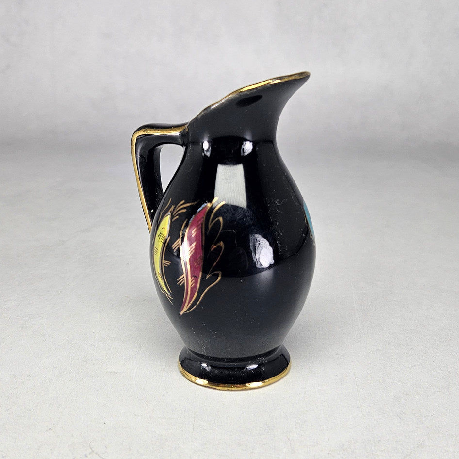 Side view of Flora Gouda Nova black miniature ceramic jug