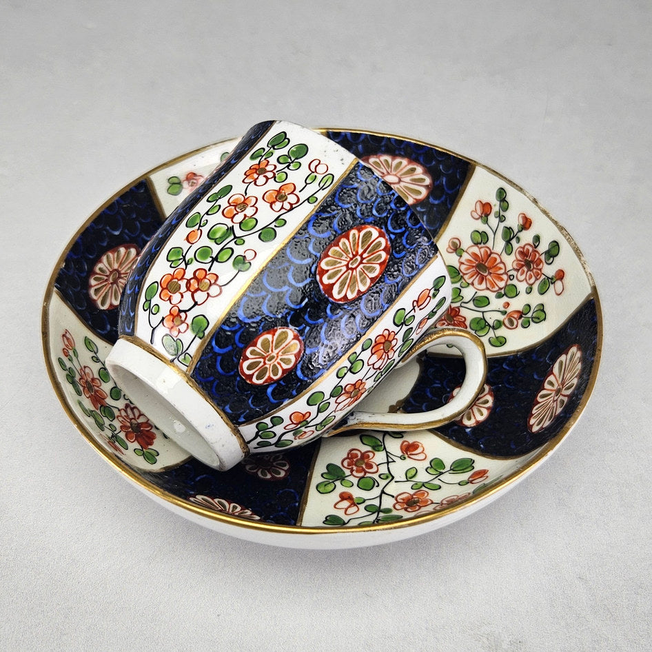Side view of Worcester cup with cobalt scale panels