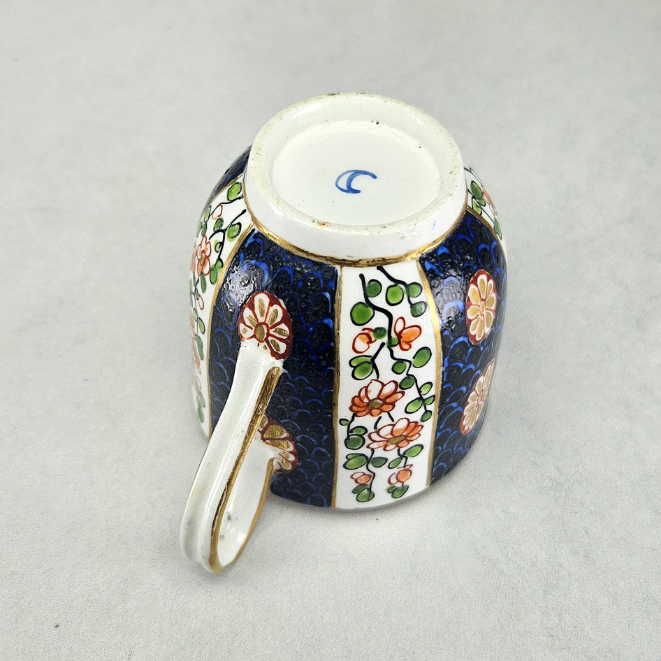 Underside of Worcester cup showing blue crescent factory mark