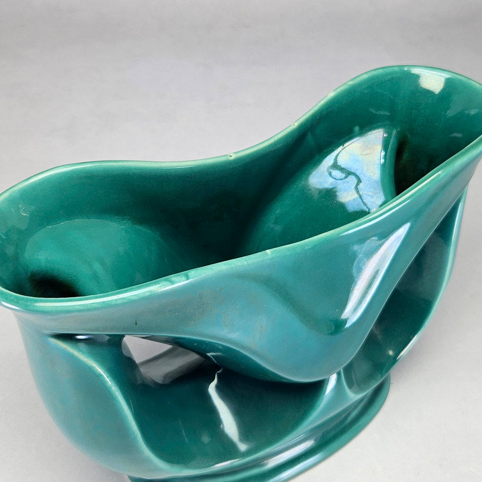 Lucia Ware attributed turquoise vase viewed towards glazed interior