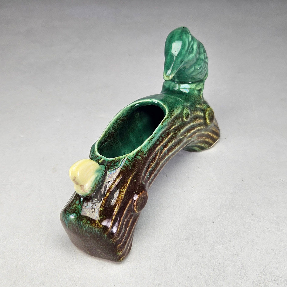 Lucia Ware bird log planter showing elongated planting opening