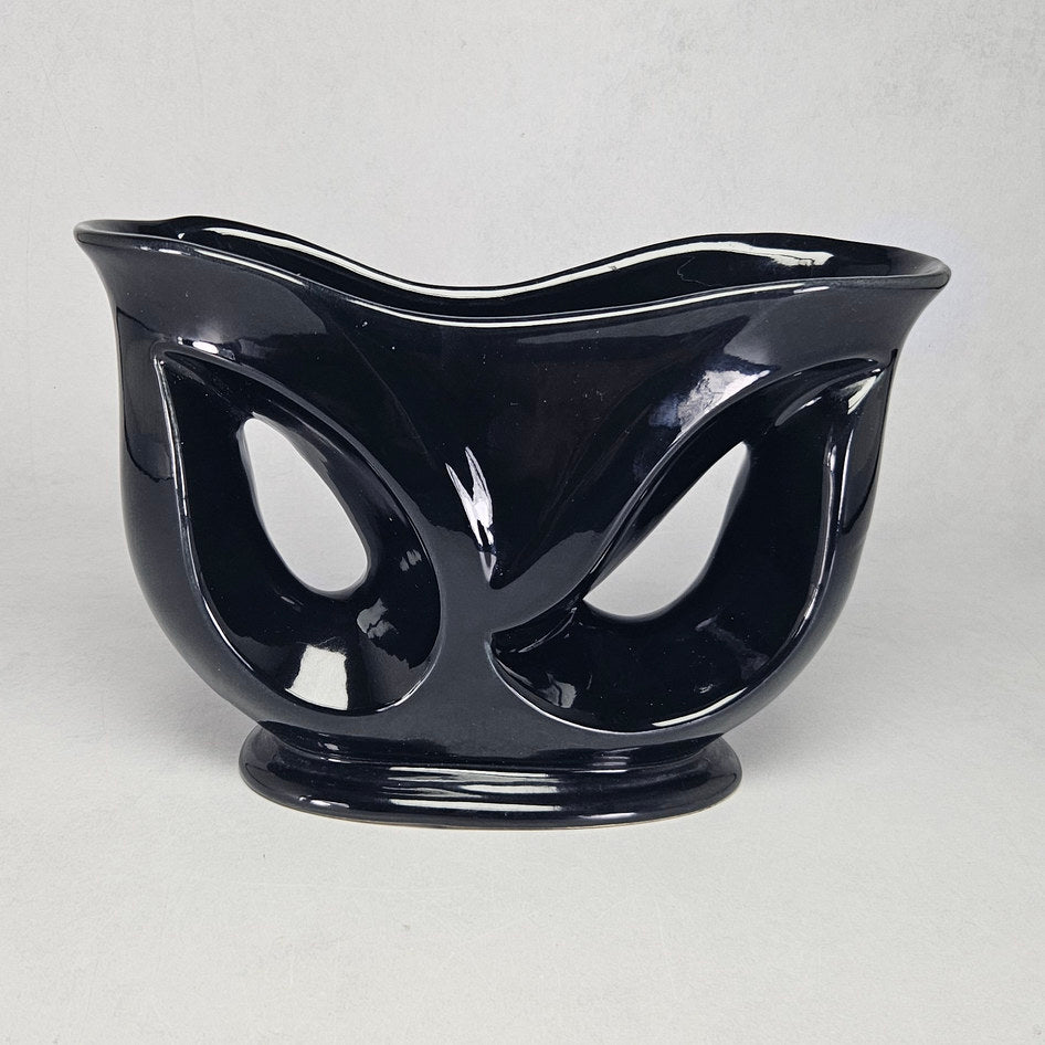 Lucia Ware black ceramic mantel vase with pierced teardrop openings