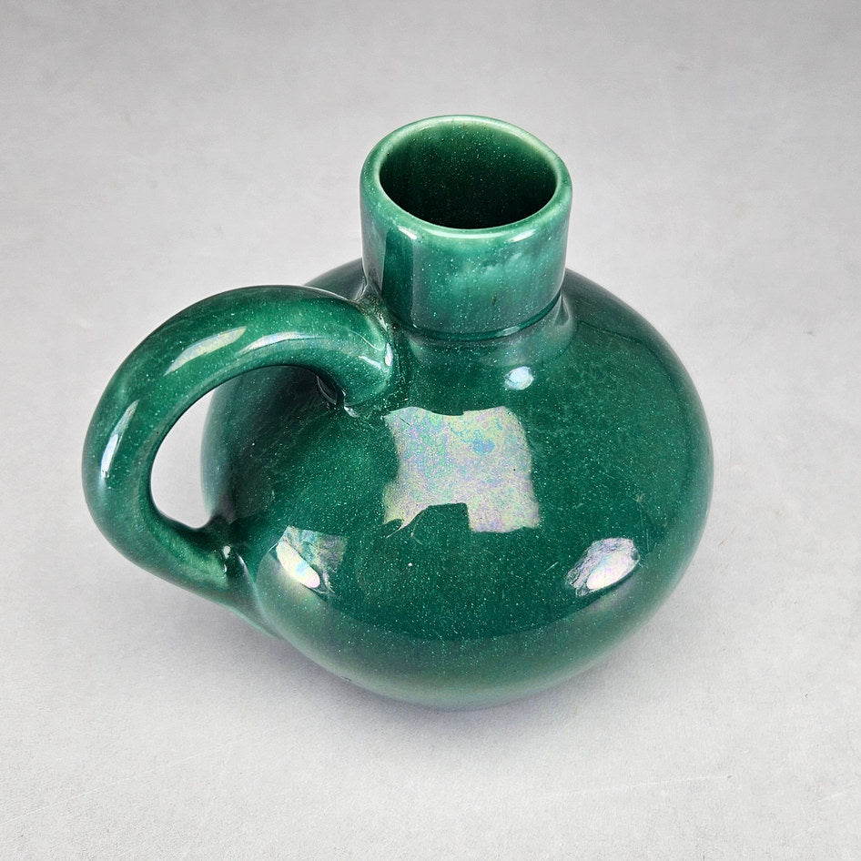 Lucia Ware green bottle vase viewed towards circular opening