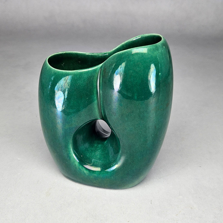 Lucia Ware green asymmetric vase showing recessed sculptural moulding