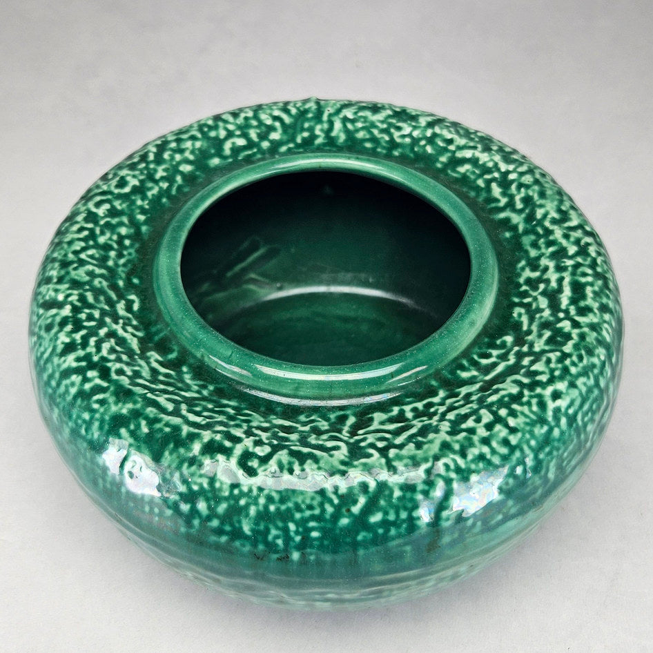 Lucia Ware green round vase viewed towards circular opening
