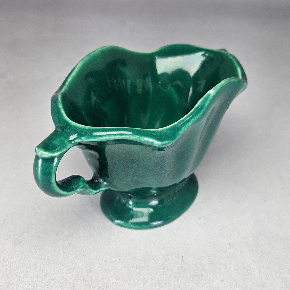 Lucia Ware green footed bowl showing flared moulded sides
