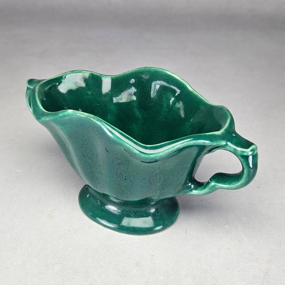 Lucia Ware green footed bowl showing undulating glazed rim