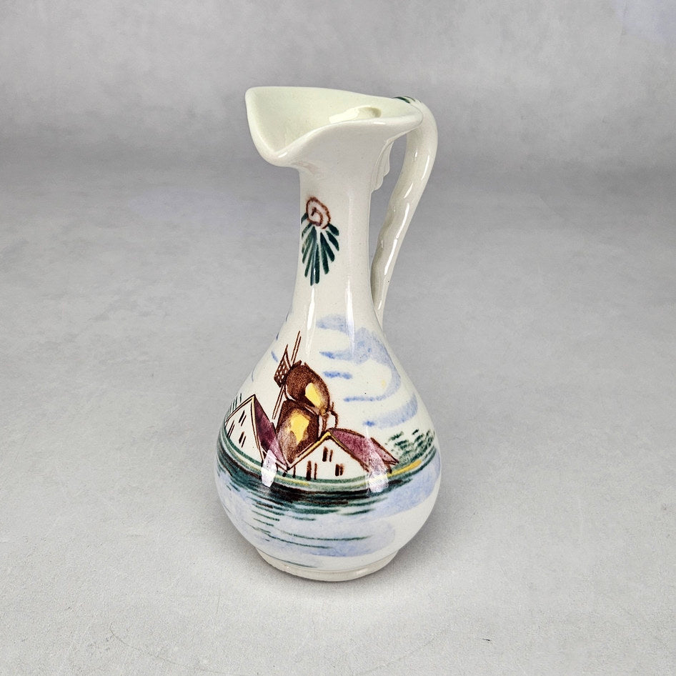 Lucia Ware cream ceramic ewer with hand-painted windmill landscape