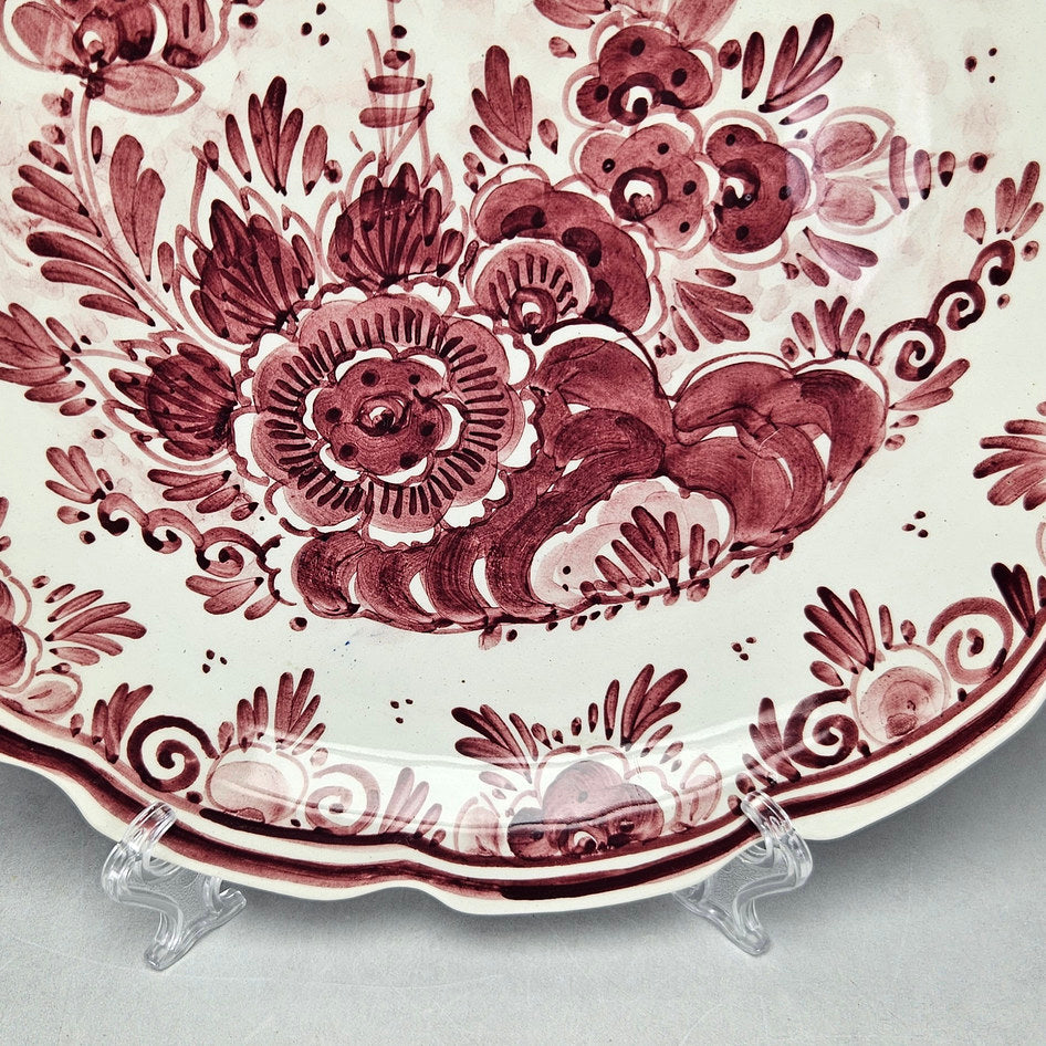 M. de Wit plate detail showing burgundy flowers and lower rim