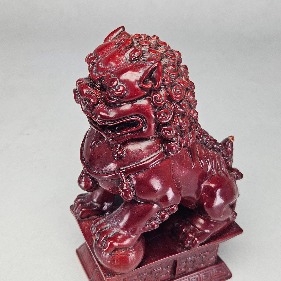 Pair of Chinese Red Cinnabar-Style Resin Foo Dog Figurines