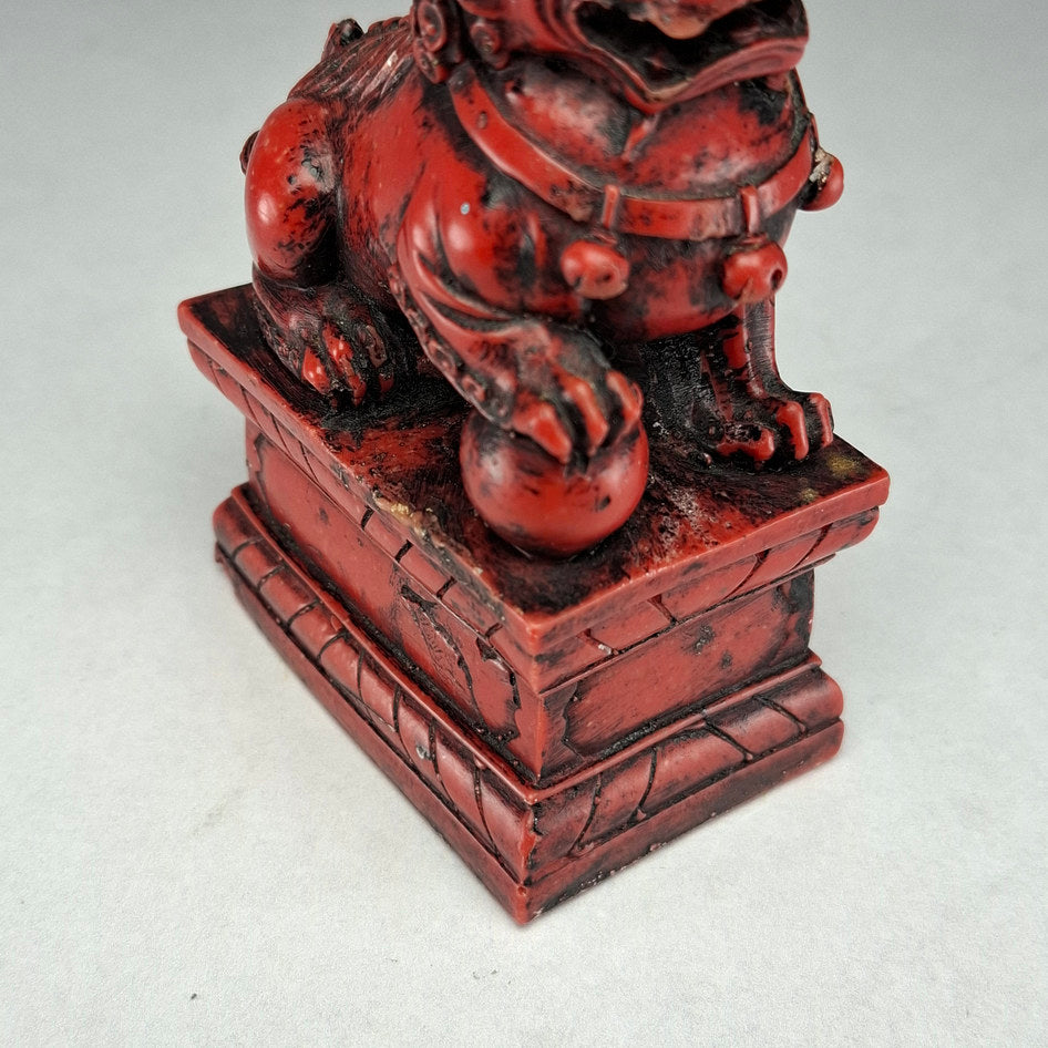 Pair of Red and Black Cast Stone Chinese Guardian Lions