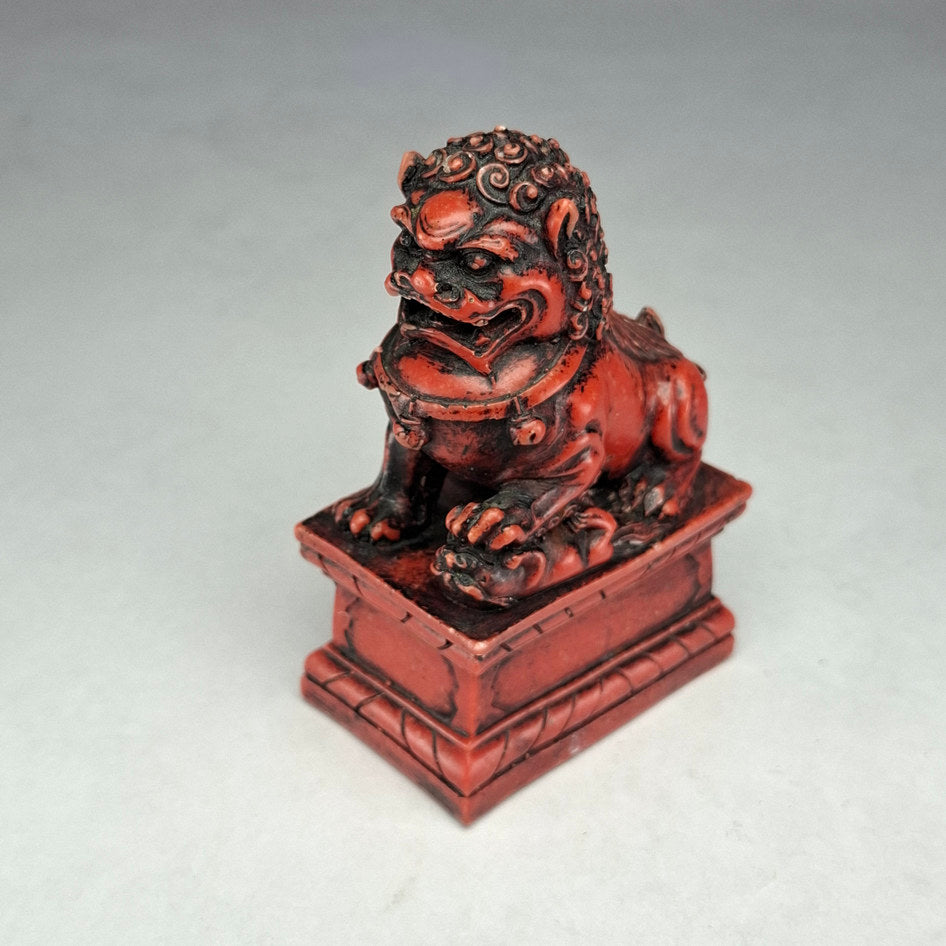 Pair of Red and Black Cast Stone Chinese Guardian Lions
