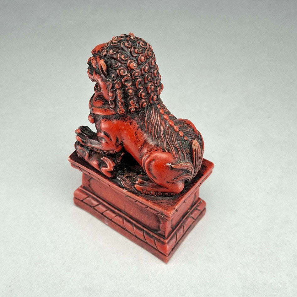 Pair of Red and Black Cast Stone Chinese Guardian Lions