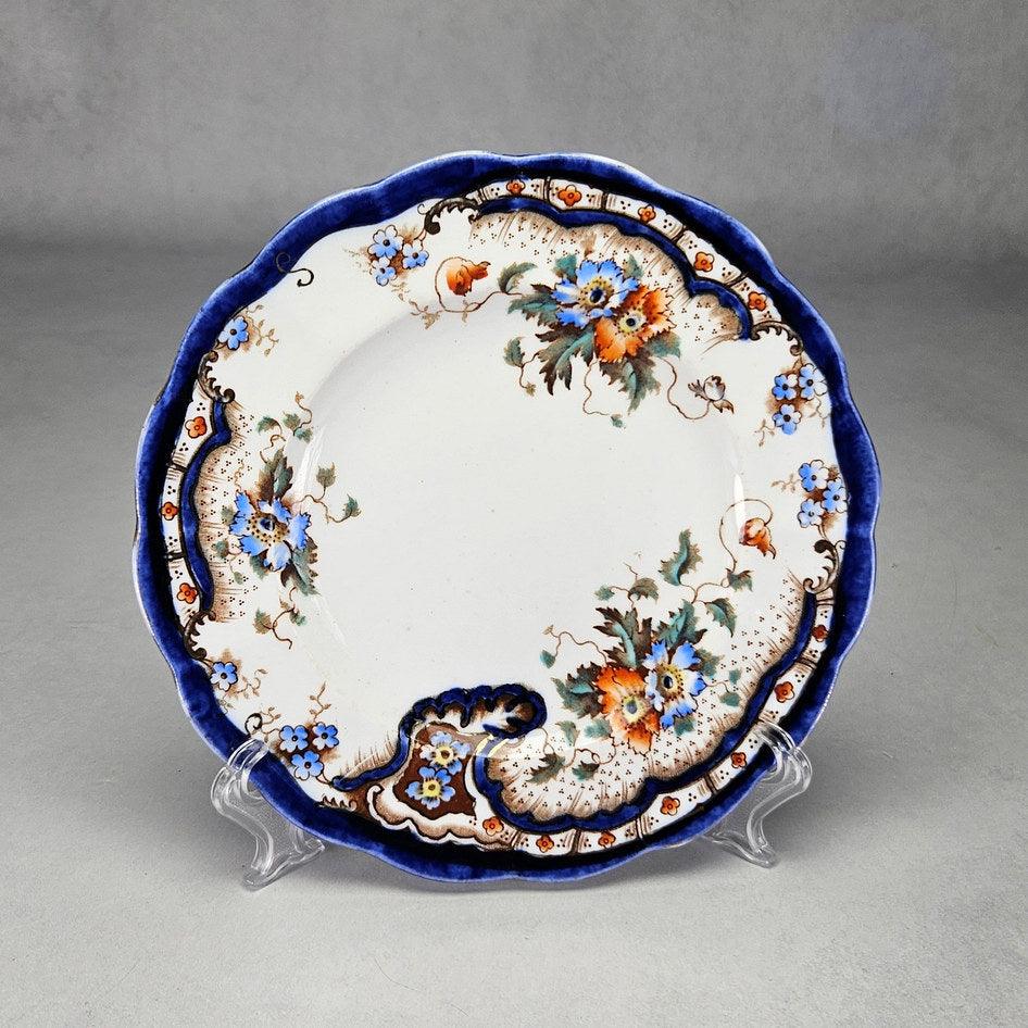 Plant Rococo and Poppy side plate with cobalt border and orange flowers