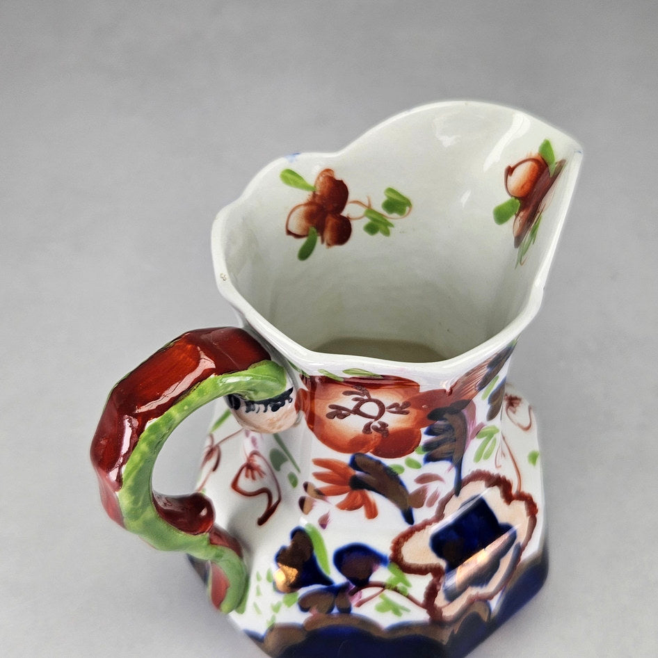 Allertons serpent handle jug with close floral and border details