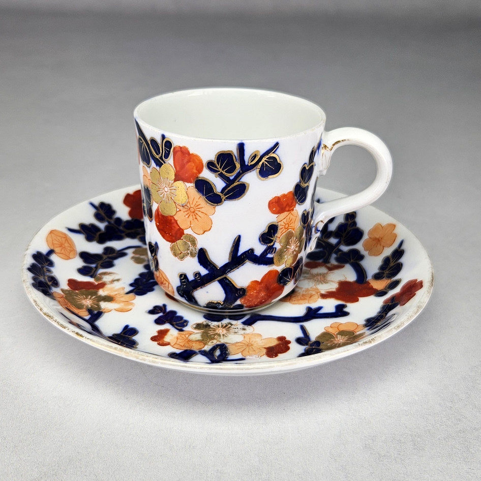 Coalport floral cup and saucer with cobalt and gilt branches