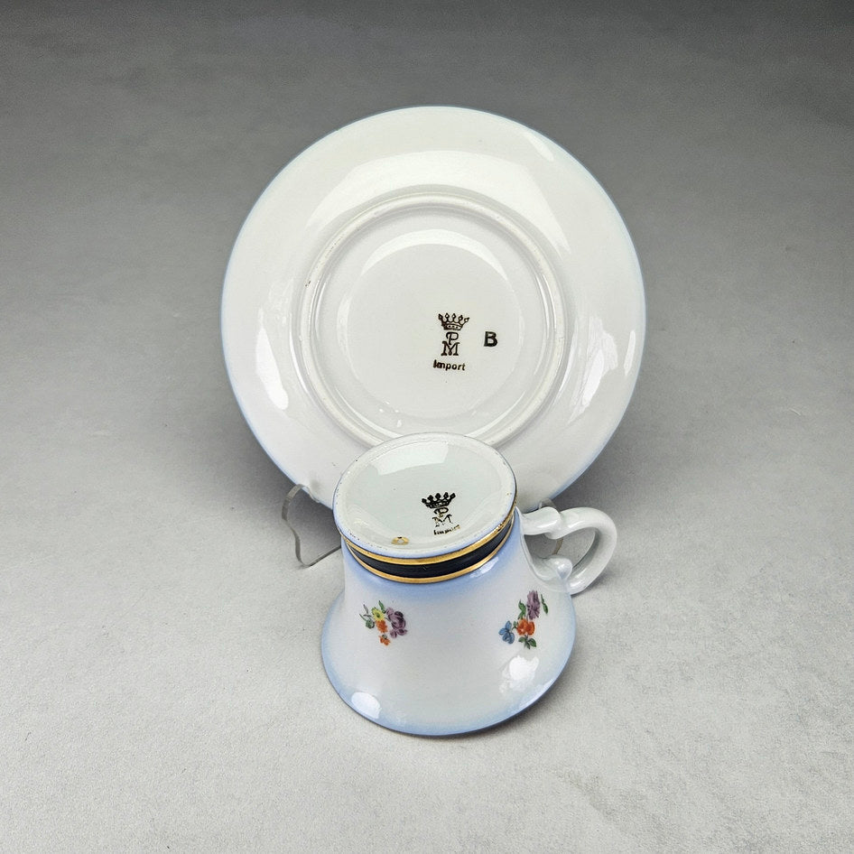 Undersides of Tivoli cup and saucer with crowned PM marks