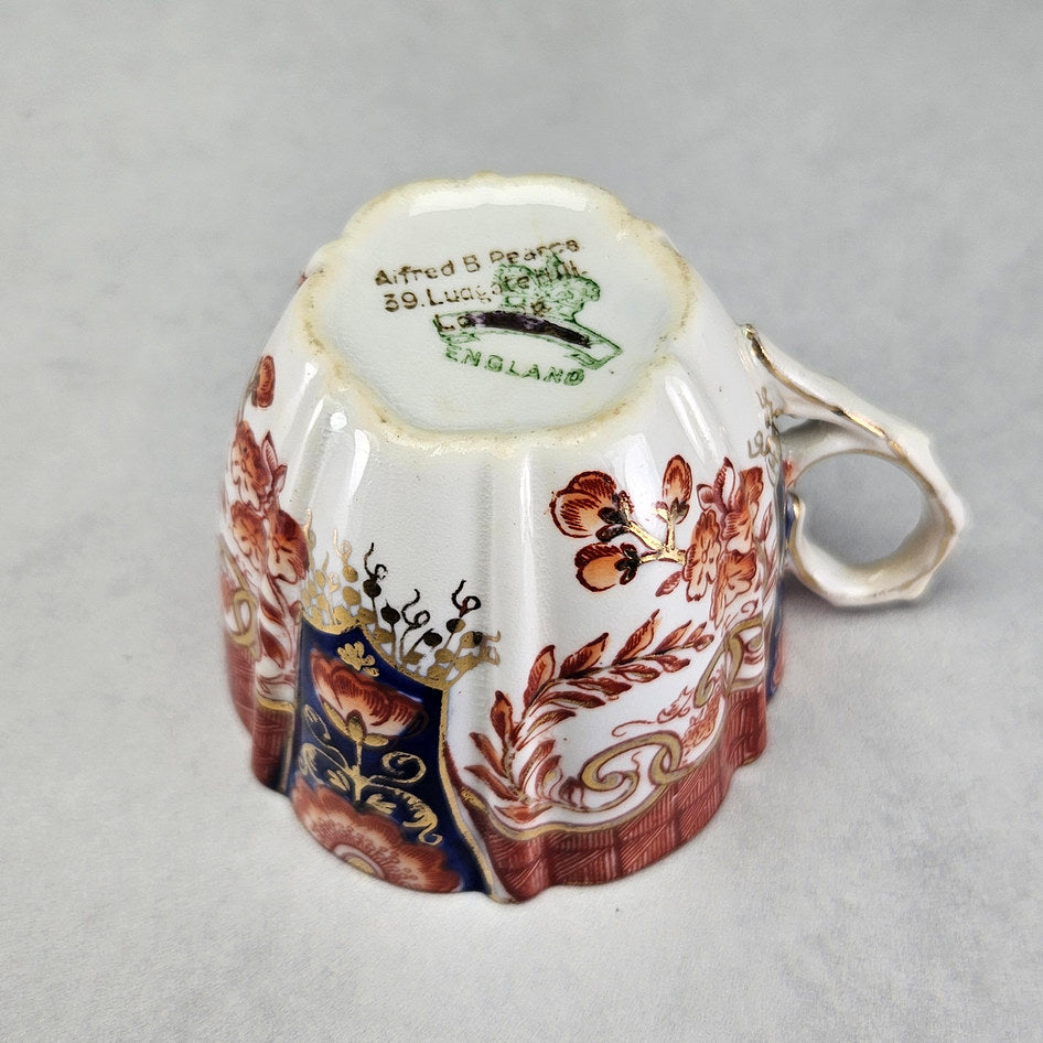 Underside of Pearce cup with Alfred B Pearce retailer stamp