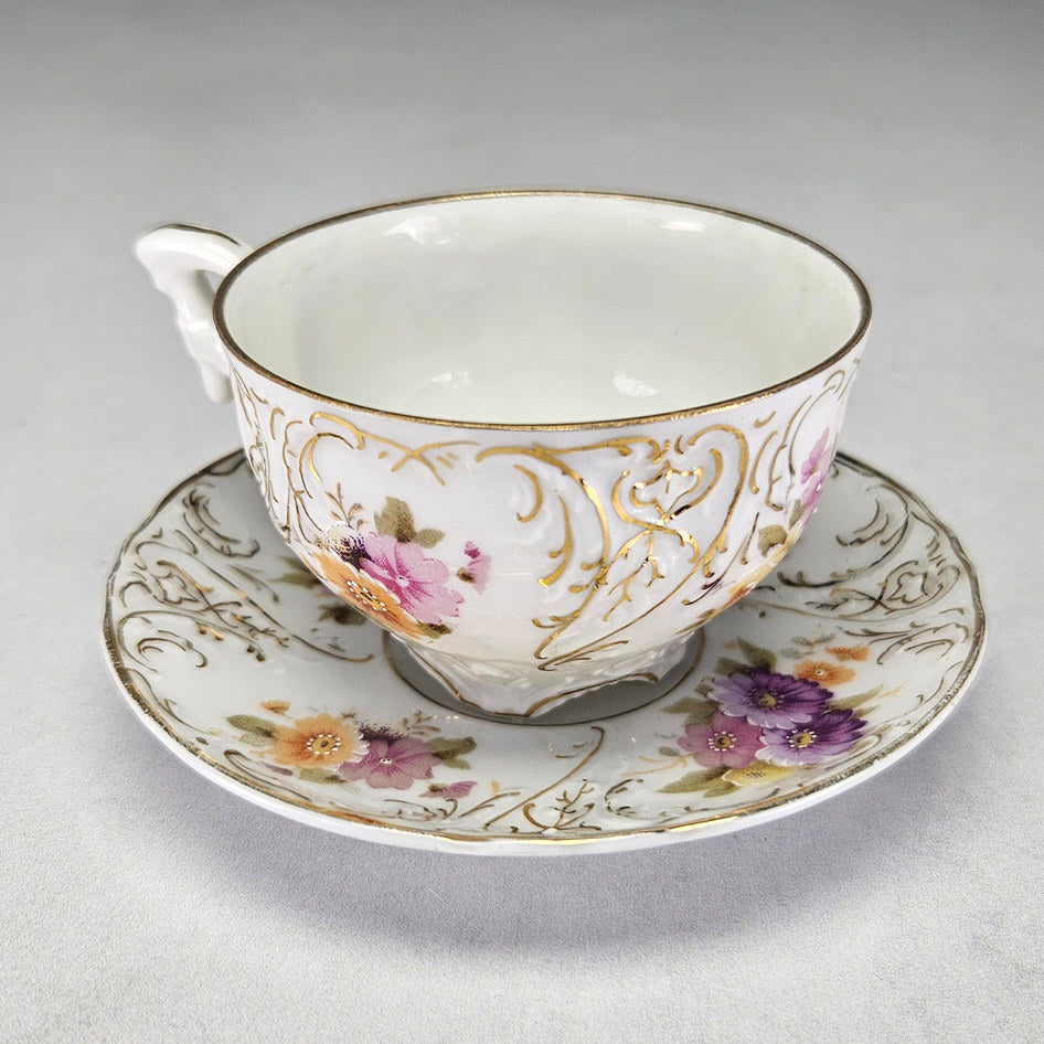 Carl Tielsch cup showing foliate handle and gilding