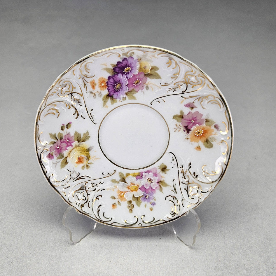 Altwasser saucer with Rococo scrollwork and painted blossoms