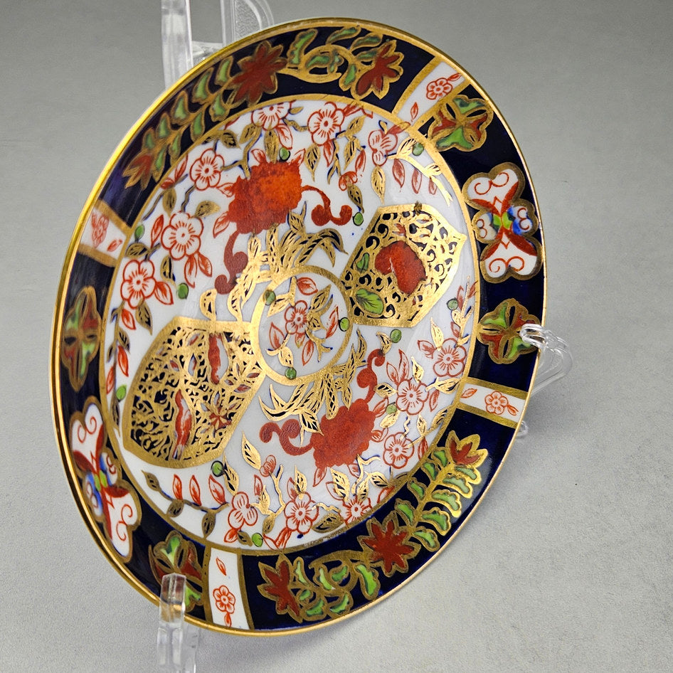 Derby Crown Imari side plate with close floral and border details
