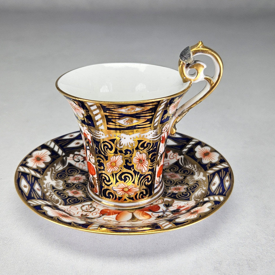 Royal Crown Derby coffee cup and saucer with repaired handle