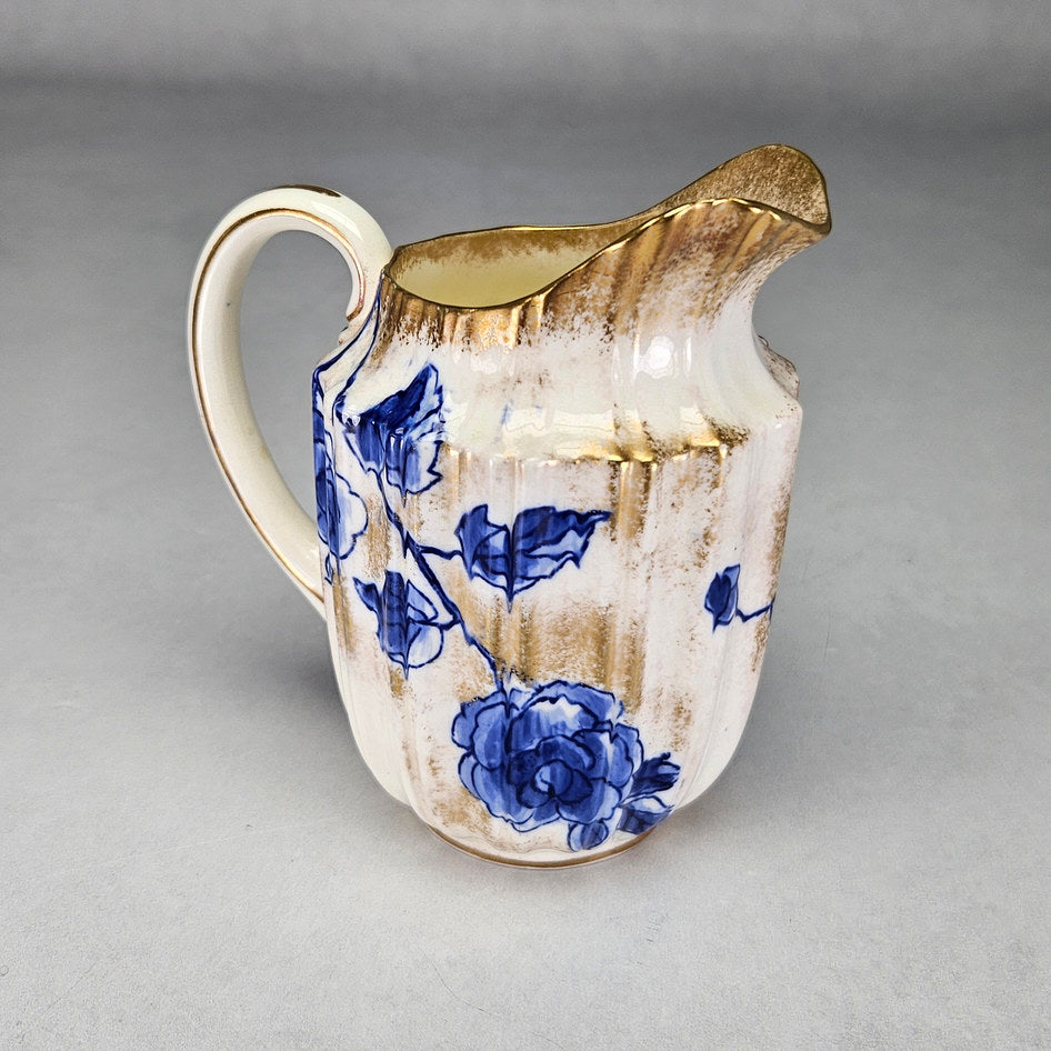 Royal Doulton C1800 cream jug with visible decorative details
