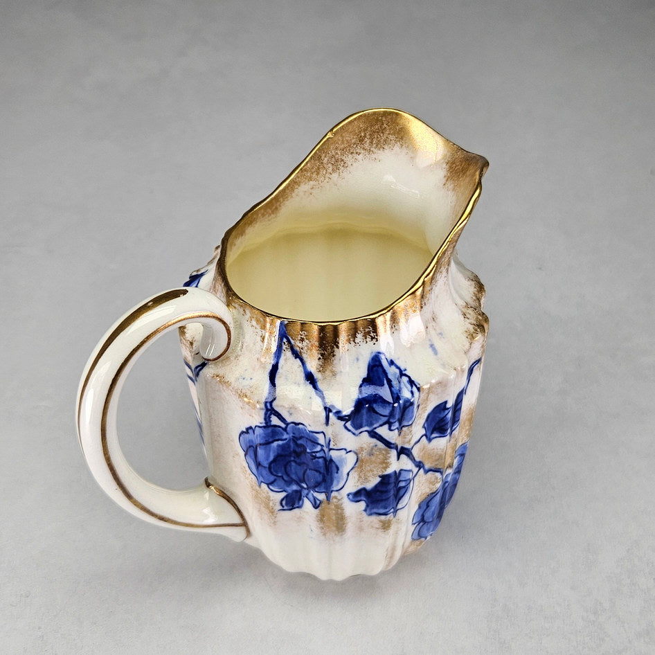 Royal Doulton C1800 cream jug showing its shaped ceramic form