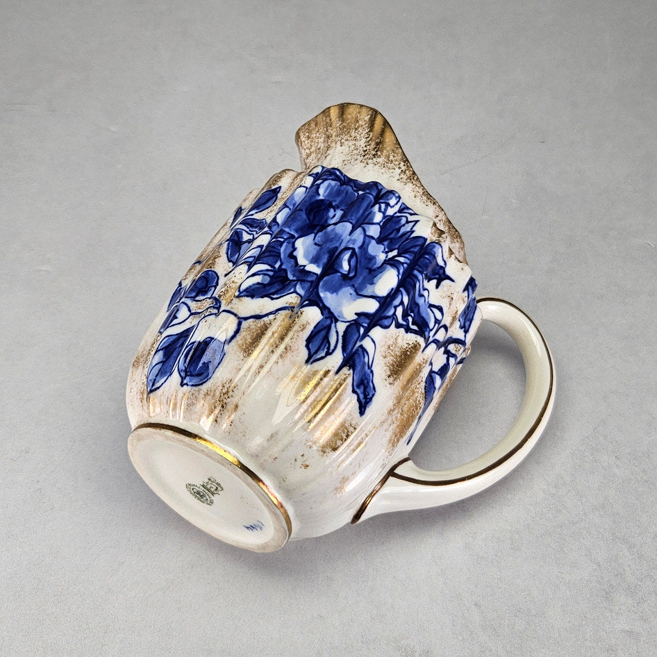 Royal Doulton C1800 cream jug with close floral and border details