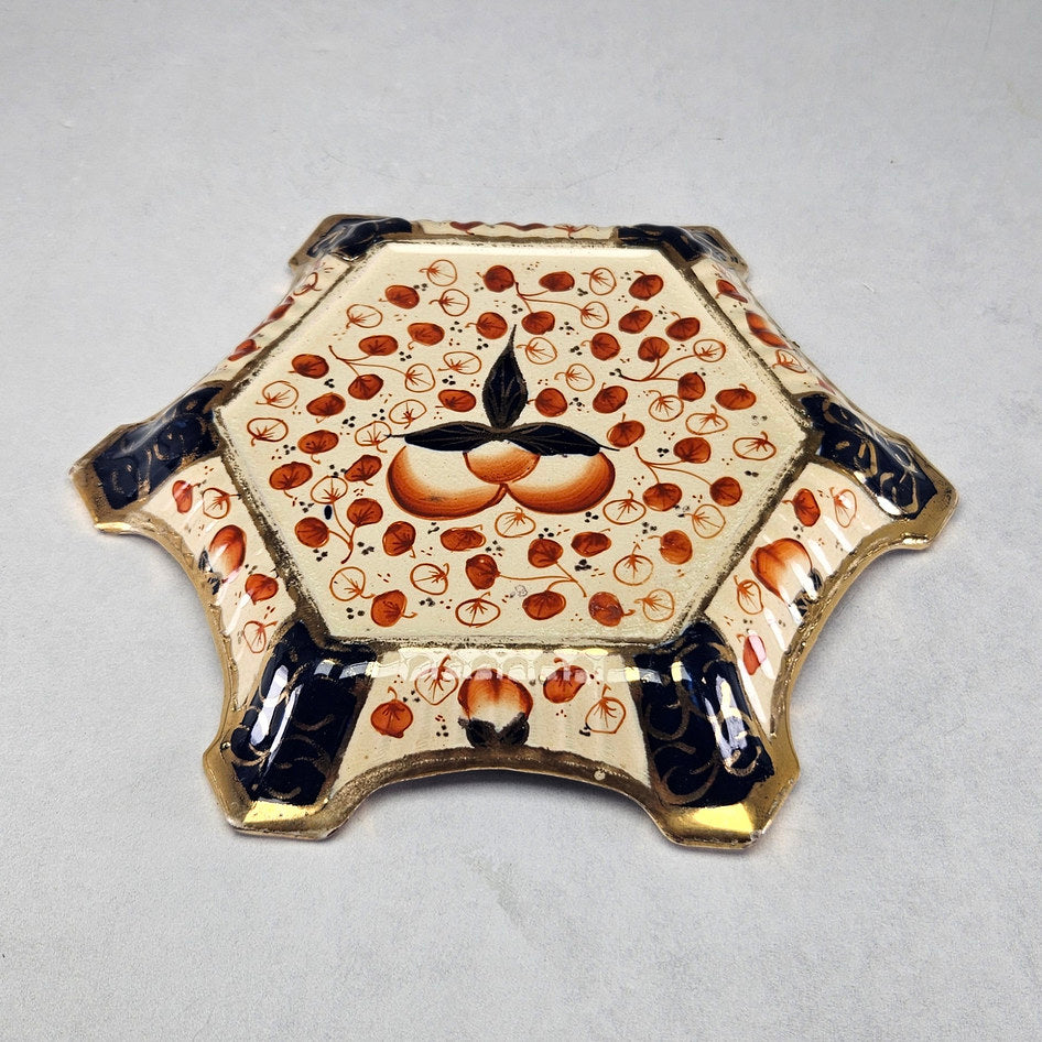 Victorian Imari teapot stand showing orange fruit and cobalt panels