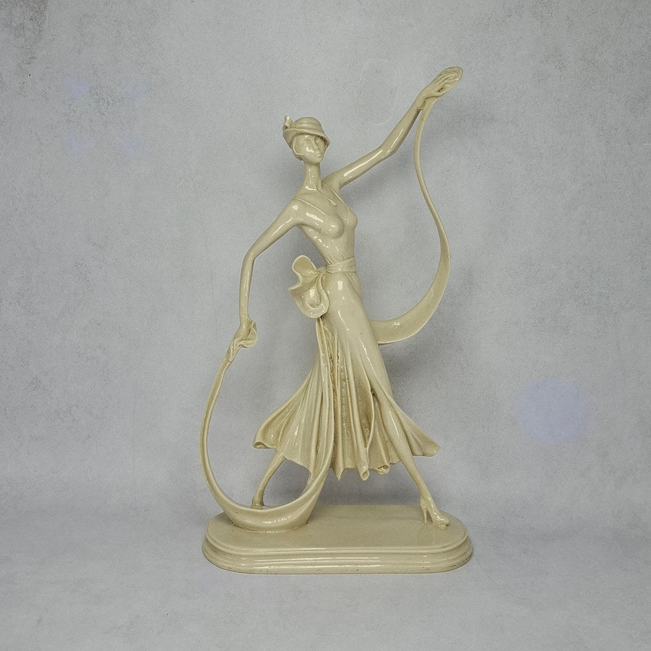 Art Deco-Style Cream Lady Figurine with Flowing Ribbon Detail