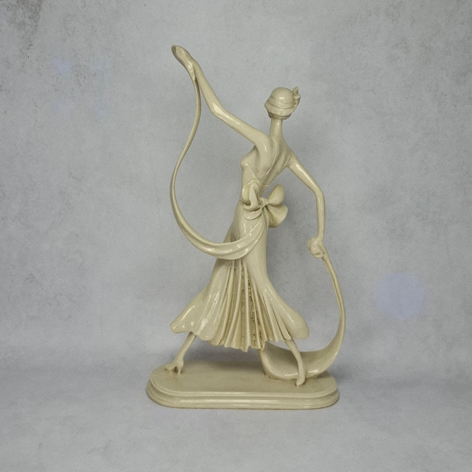 Art Deco-Style Cream Lady Figurine with Flowing Ribbon Detail