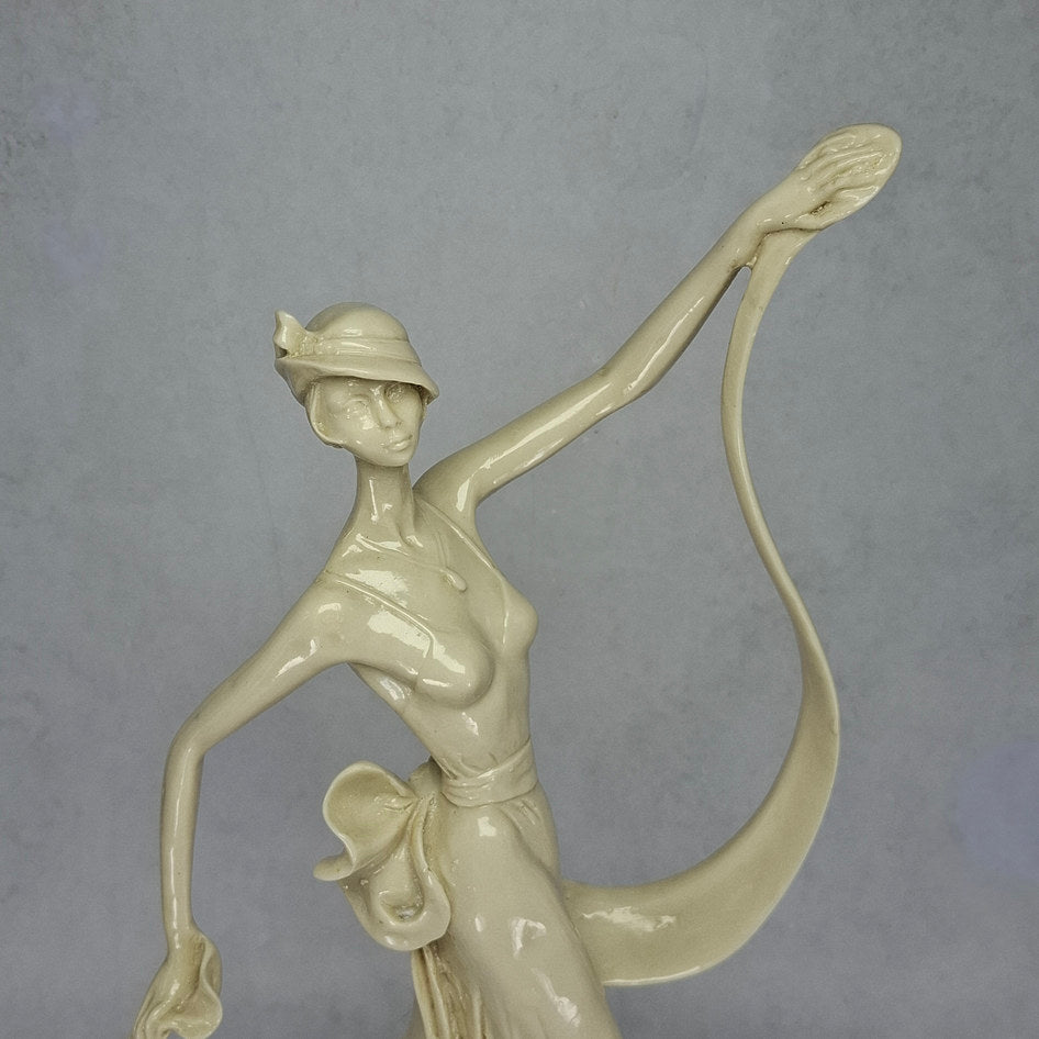 Art Deco-Style Cream Lady Figurine with Flowing Ribbon Detail