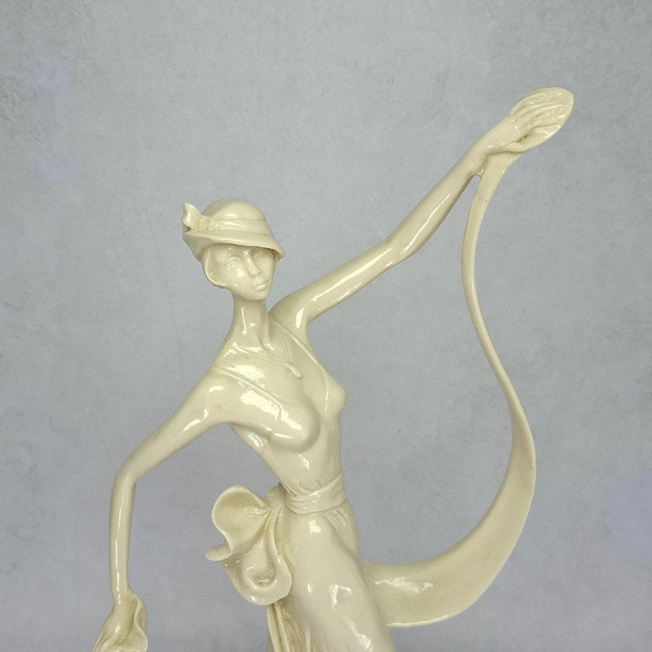 Art Deco-Style Cream Lady Figurine with Flowing Ribbon Detail