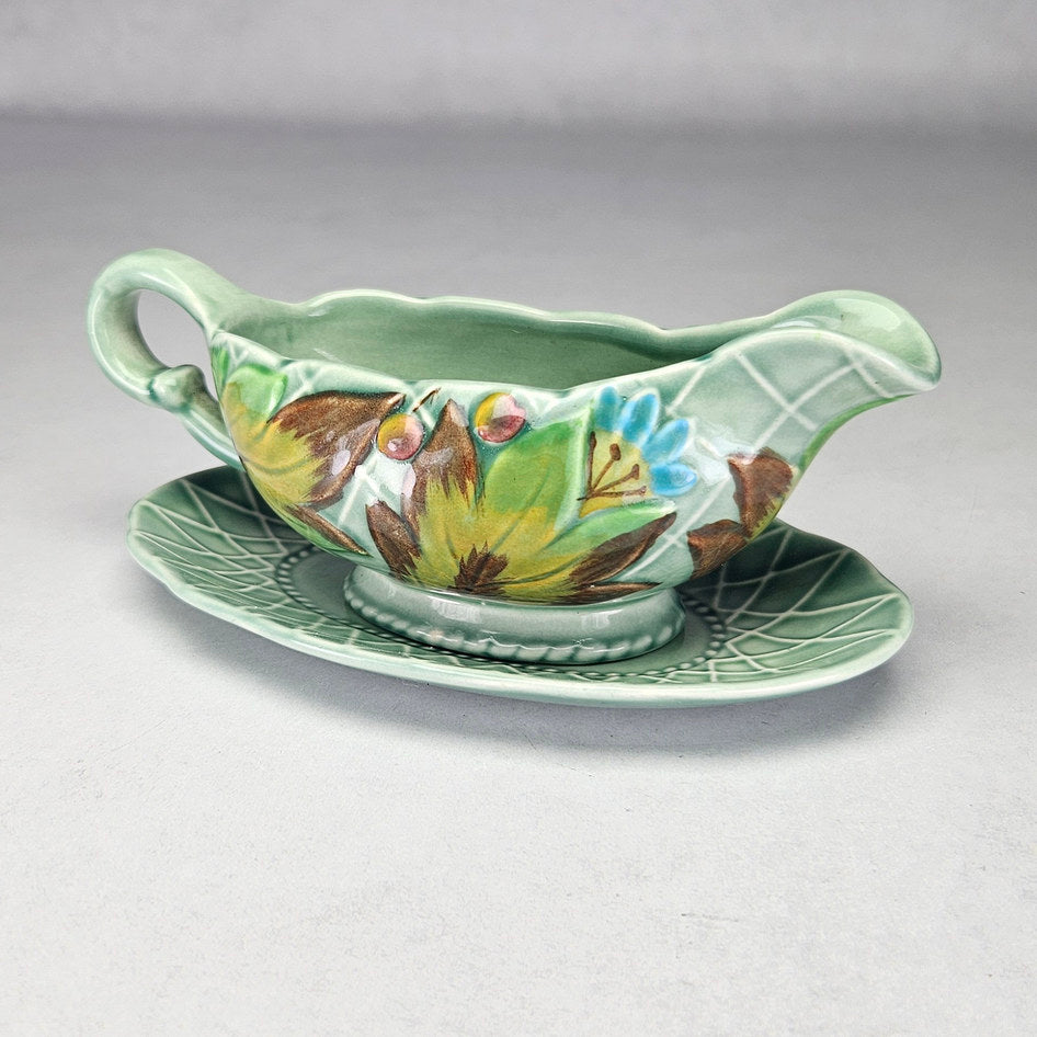 Clarice Cliff Newport leaf and berry sauce boat with stand, photograph 3 of this collectible ceramic piece