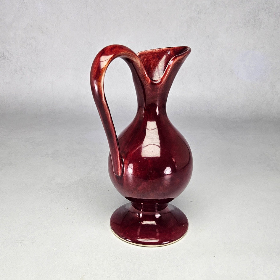 Drostdy Ware burgundy ewer showing raised curved loop handle